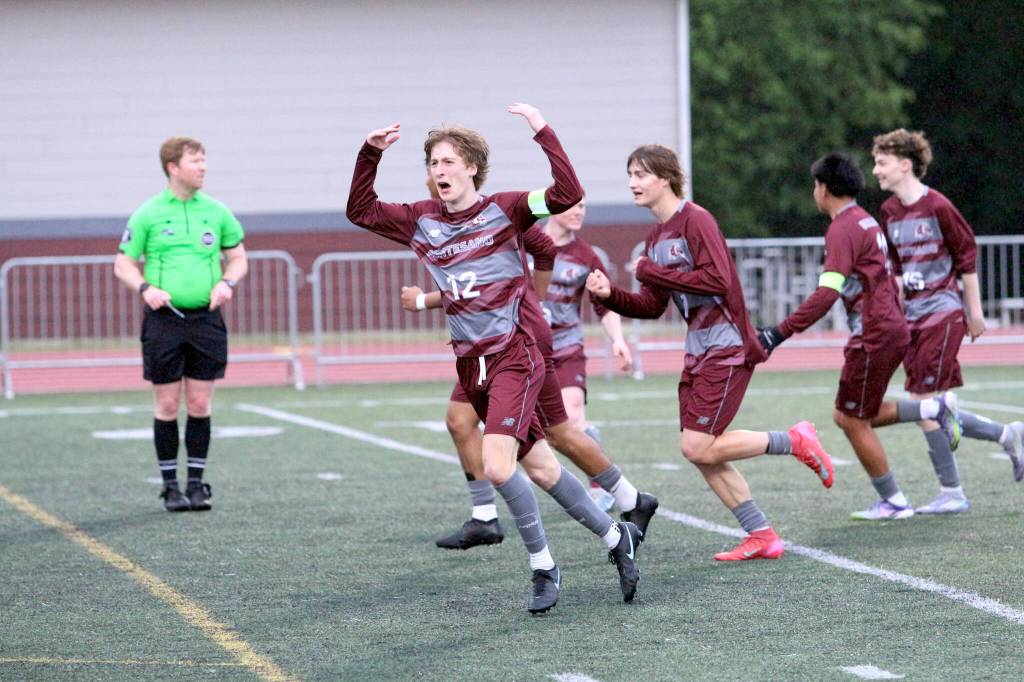 RYAN SPARKS | THE DAILY WORLD Montesanos Daniel Schallon (12) celebrates with his teammates after scoring a goal in 3-2 loss to La Center a 1A District 4 Tournament elimination game on Thursday at Montesano High School.
