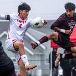 PHOTO BY MATT RUMBLES Raymond-South Bends Jose Ramirez (7) leaps to make a play against Columbia-White Salmons Juan Santoyo-Luna during a 1-0 win in a 1A District 4 Tournament semifinal game on Thursday at Sanchez Field in South Bend.