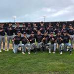RYAN SPARKS | THE DAILY WORLD The Montesano Bulldogs pose for a photo after winning the 1A District 4 championship with a 4-0 victory over Seton Catholic on Saturday at Olympic Stadium in Hoquiam.