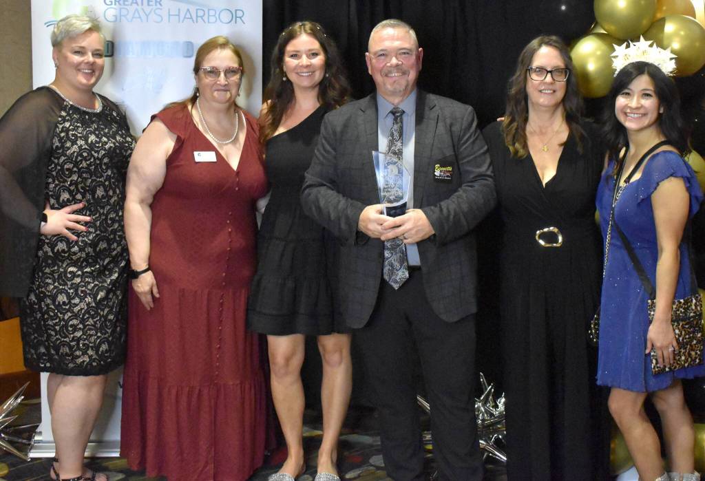 Jerry Knaak / The Daily World
Greater Grays Harbor, Inc. Betsy Seidel Ambassador of the Year award went to Larry Burgher, who poses for a photo with fellow ambassadors and GGHI staff.