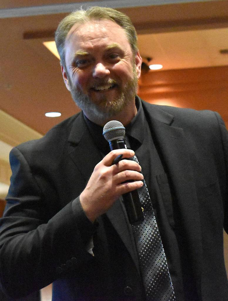 Jerry Knaak / The Daily World
2026 GGHI Leaders Banquet & Business Recognition Awards Master of Ceremonies Pat Anderson of KXRO News Radio mugs for the camera.