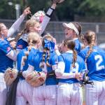 NICOLE SHANNON | MAIN FOCUS MEDIA The Elma Eagles celebrate a 10-2 district-semifinal victory over Lynden Christian on Saturday at Fort Borst Park in Centralia.