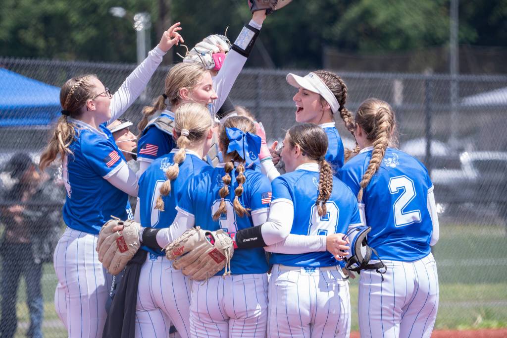 NICOLE SHANNON | MAIN FOCUS MEDIA The Elma Eagles celebrate a 10-2 district-semifinal victory over Lynden Christian on Saturday at Fort Borst Park in Centralia.