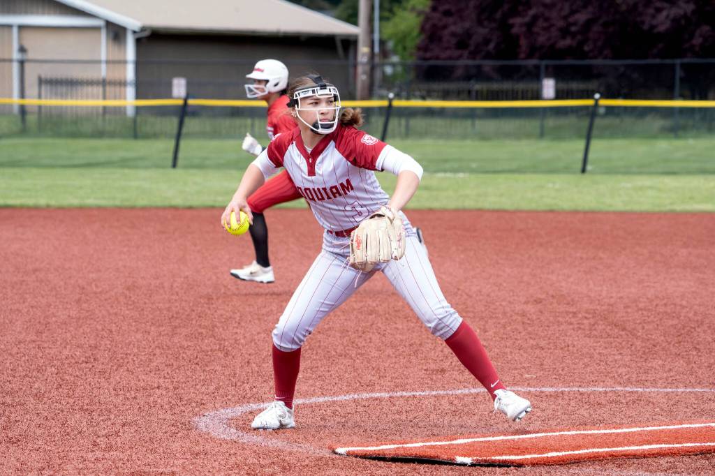 NICOLE SHANNON | MAIN FOCUS MEDIA Hoquiam pitcher Hallie Burgess throws to first during a 10-8 loss to Columbia-White Salmon in a 1A District elimination game on Saturday in Centralia.