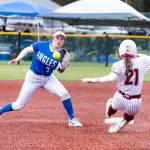 NICOLE SHANNON | MAIN FOCUS MEDIA Elma shortstop Aubree Simmons (left) receives a throw while Montesanos Ashlyn Lytle races to second base in the Bulldogs 14-0 win in the 1A District championship game on Saturday in Centralia.