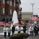A Coast Guard color guard and veterans organizations parade the colors during the remembrance of those who put out to sea and did not return at a past event.