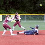 RYAN SPARKS | THE DAILY WORLD Ocosta shortstop Khloe OHagan (left) receives a throw as a Naselle player steals second during the Wildcats 17-9 loss in the 1B District 4 championship game on Saturday at Dick Tagman Field in Montesano.