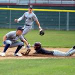 RYAN SPARKS | THE DAILY WORLD Montesanos Zach Timmons (right) slides in ahead of the tag by Seton Catholic shortstop Teddy Wieczorek during the Bulldogs 4-0 victory in the 1A District 4 championship game on Saturday at Olympic Stadium in Hoquiam.