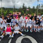 PHOTO BY CINDY MILES The Elma Eagles pose for a photo after a 2-1 victory over Columbia-White Salmon in a 1A District 4 Tournament elimination game on Saturday in Tenino.