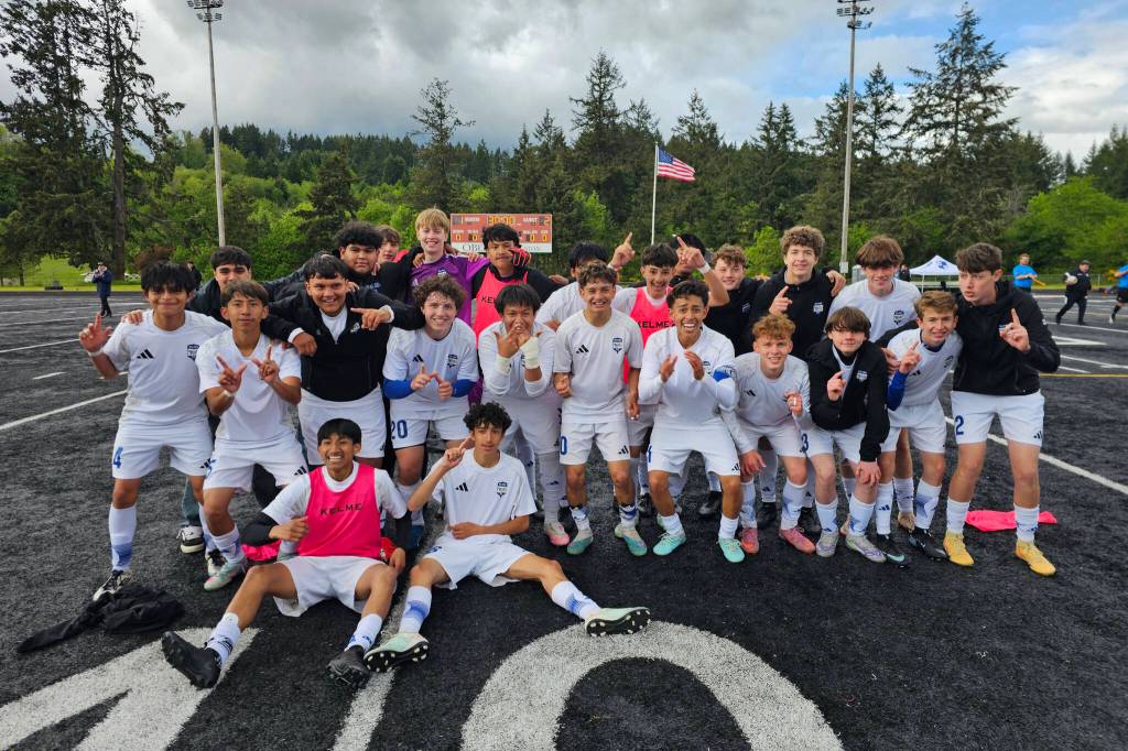 PHOTO BY CINDY MILES The Elma Eagles pose for a photo after a 2-1 victory over Columbia-White Salmon in a 1A District 4 Tournament elimination game on Saturday in Tenino.