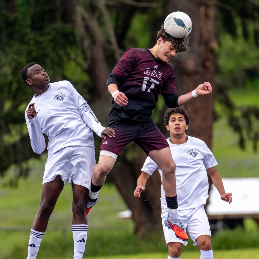 MATT RUMBLES PHOTOGRAPHY Raymond-South Bends Jayden Silva (17) gets his head on the ball during a 2-0 loss to Kings Way Christian in the 1A District 4 championship game on Saturday in Tenino.
