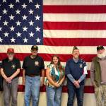 Jerry Knaak / The Daily World
April Messenger, field representative for U.S. Rep. Emily Randall , poses for a photo with members of North Beach VFW Post 8956 in Ocean Shores.