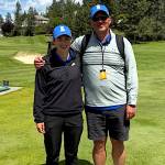 SUBMITTED PHOTO Elma senior Olivia Moore (left) and her head coach and father, Ryan Moore, pose for a photo after she placed fifth at the 1A State Golf Championships on Wednesday at the MeadowWood Golf Course in Liberty Lake. It was Olivias fourth top-five finish at the state tournament of her prep career.