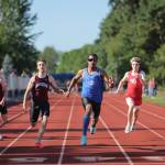 PHOTO BY MIKE ROBERTS Elmas Ritchie Guadarrama (middle) won the boys 100 (pictured), 200 and 400-meter races at the 1A District 4 Championships on Thursday at Seton Catholic High School in Vancouver.