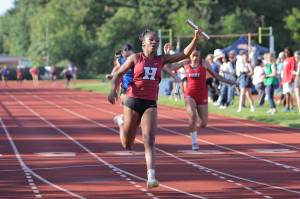 PHOTO BY MIKE ROBERTS Hoquiam sophomore RanaèJah Burtensah runs the anchor leg of the Grizzlies 4x400-meter relay team at the 1A District 4 Championships on Thursday at Seton Catholic High School in Vancouver.
