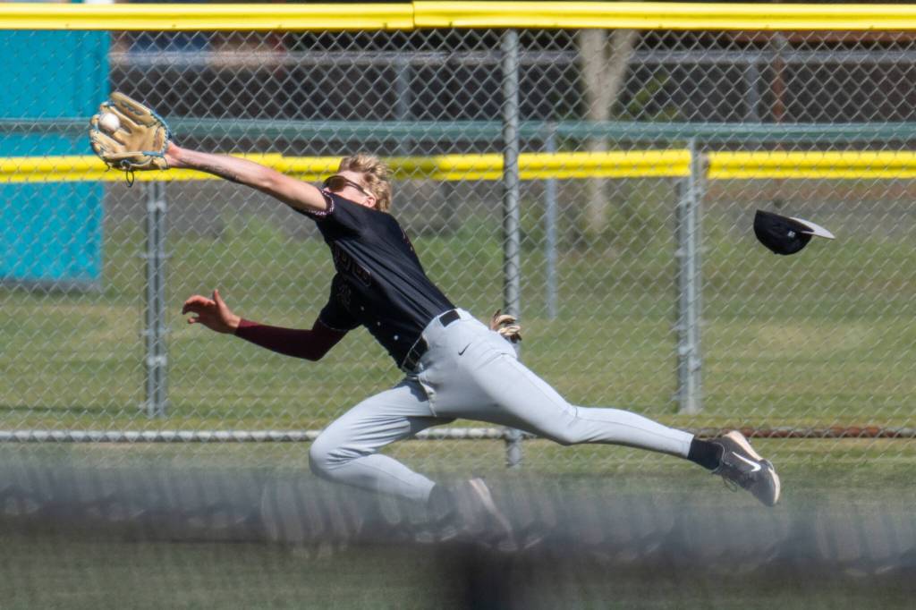 PHOTO BY FOREST WORGUM Montesano left fielder Mason Fry makes a diving catch during a 3-0 win over Charles Wright-Life Christian Academy in a 1A State semifinal game on Saturday in Hoquiam.