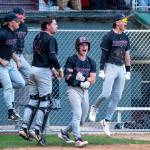 PHOTO BY FOREST WORGUM Montesano players celebrate a home run by teammate Carter Ames during a 3-0 win over Charles Wright-Life Christian Academy in a 1A State semifinal game on Saturday in Hoquiam.
