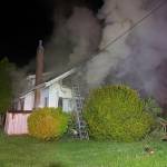 Smoke billows out of the home in Hoquiam.