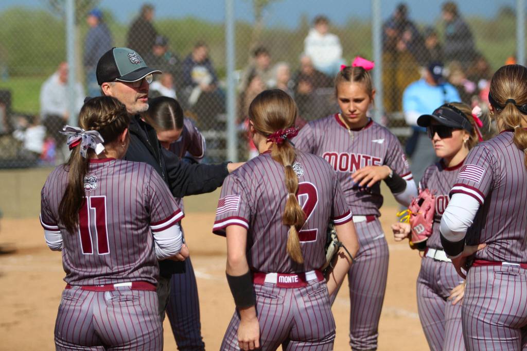 DAILY WORLD FILE PHOTO Montesano head coach Pat Pace (left) talks to his team during a game against Aberdeen on April 28. The Bulldogs finished the season with a perfect record for the first time in the veteran head coachs 29 years at the helm of the program.