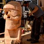 Chainsaw artist Brian Vorwaller works on his creation at the 2025 Sand and Sawdust Festival.