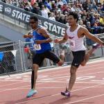 PHOTO BY MIKE ROBERTS Elmas Ritchie Guadarrama (left) races with Kings Jeshua Singletary during a boys 200-meter race at the WIAA 1A State Championships on Saturday at Eisenhower High School in Yakima.