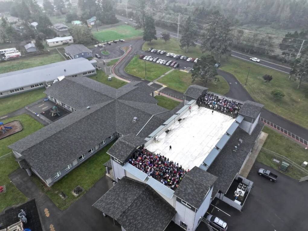 Karen Ducey / The Seattle Times
Students gather on the gym roof at Ocosta Elementary School during the annual Great ShakeOut drill last year. The building was the nations first tsunami evacuation structure, designed to withstand a Cascadia Subduction Zone earthquake and provide shelter on the roof for up to 2,000 people.
