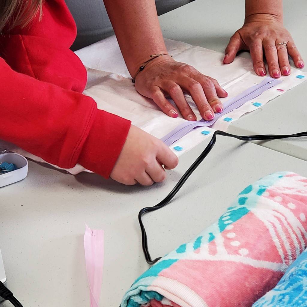 Andrea Watts / The Daily World
The project being made on the workshops last session was a beach towel bag, which had the kids learn how to work with zippers.