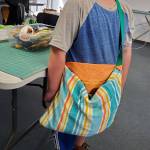A 4-H youth member models his completed beach towel bag. (Andrea Watts / The Daily World)