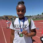 SUBMITTED PHOTO Hoquiam sophomore RanaèJah Burtenshaw poses with her state-championship medal after winning the 1A Girls 100 meters on May 30 at Eisenhower High School in Yakima.