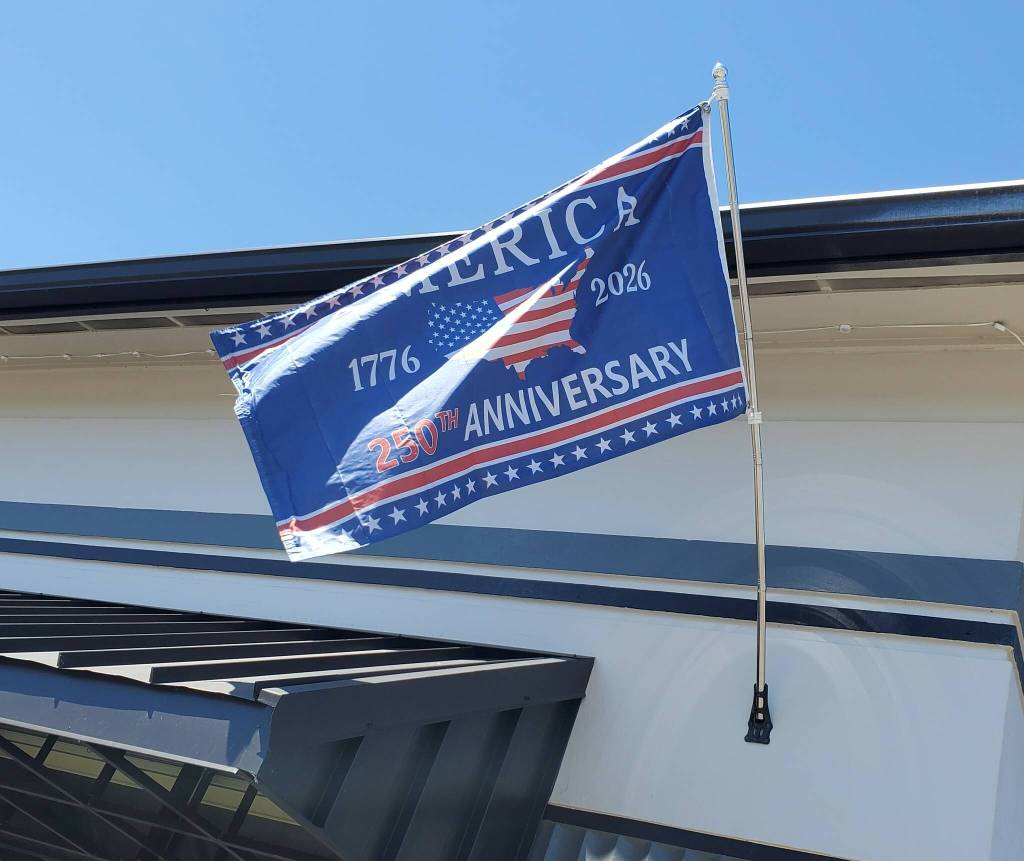 Andrea Watts / The Daily World
The city of Elma has decorated its city hall with a 250th anniversary flag and banners in the windows.