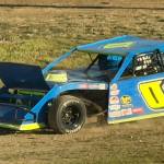 Olympias Zach Dalrymple exits the track to the infield after his hood popped open during a heat race for the 2026 Timber Cup in Elma.