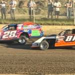 Jake Sorenson (#28) duels with Austin Rognlin on the backstretch during the Timber Cup on Monday in Elma.