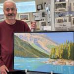 Jerry Knaak / The Daily World
Bob Shepard poses for a photo with one of his creations at the Gallery of Ocean Shores.