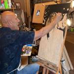 Jerry Knaak / The Daily World
Douglas Orr, an artist who doubles as the mayor of Aberdeen, works on a painting of Kurt Cobain.