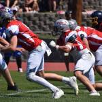 Tina Caton
Three Bulldog defensive linemen (from left) Mason Fry, Isac Hawkins and Lucas Delgado take off on the snap at the state all star football game.