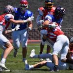 Tina Caton
Montesanos Kole Kjesbu (#24) makes a jarring tackle at the all star football game in Yakima. Teammate Mason Fry (left) comes to assist.