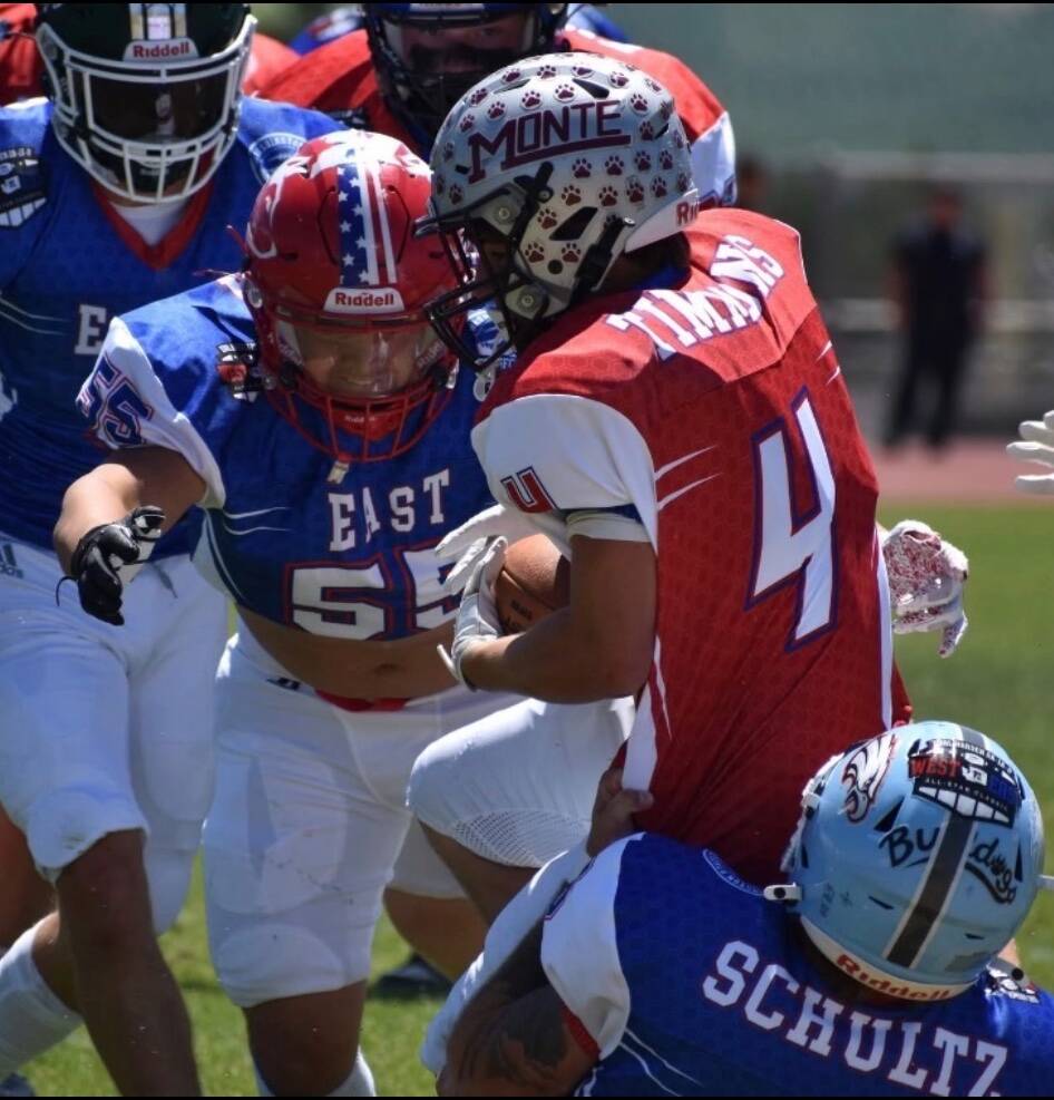 T. Michaels / The Daily World
Montesanos Zach Timmons (#4) fights for extra yardage in the Earl Barden Football Classic in Yakima.