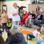 Jerry Knaak / The Daily World
Don Riggs shows off the black dragon lizard known as Toothless to the Reptile Isle visitors at the Ocean Shores Public Library.