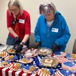 Jerry Knaak / The Daily World
Friends of the Ocean Shores Public Library serve up slices of apple pie.