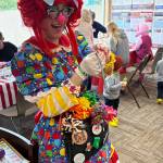 Jerry Knaak / The Daily World
Rayven the Clown gets ready to make a balloon animal.