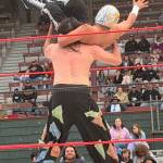 Rogue Wrestling Attractions luchador Chuco Bumm gets ready to slam Marco AR Antonio during their undercard match Saturday at Olympic Stadium.