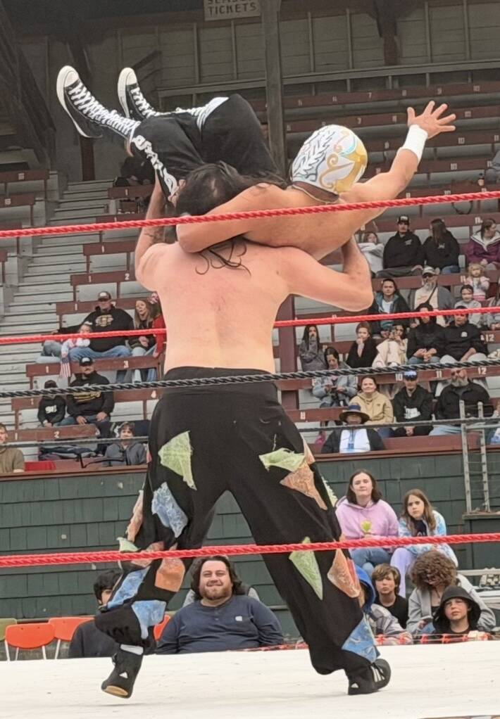 Rogue Wrestling Attractions luchador Chuco Bumm gets ready to slam Marco AR Antonio during their undercard match Saturday at Olympic Stadium.