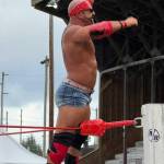 T. Michaels photos / The Daily World
The Ideal Reflection Christopher Ryseck, with mirror in hand, celebrates his win over J.B. Moonshine at Red, White, and Bruised Saturday.