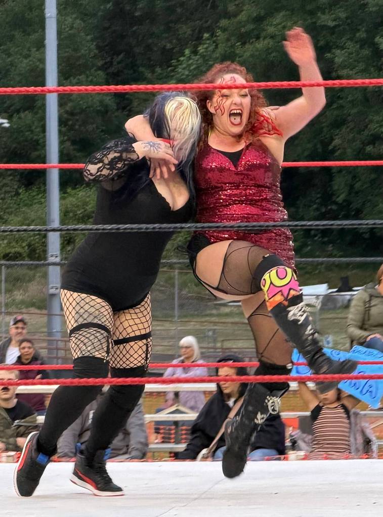 Sunni Daze puts a running headlock on Janis Jett wrestling for the first Rogue Wrestling Attractions Womens Championship at Olympic Stadium.