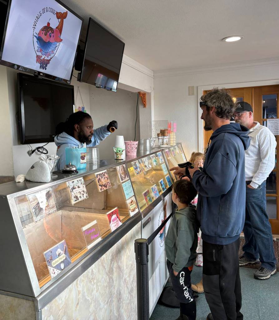 Whale of a Cone owner Jah serves customers in Westport. (Jerry Knaak / Washington Coast Magazine)
Whale of a Cone owner Jah serves customers in Westport.