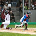 PHOTO BY ELENA MILLS A player from Montesano (left) slides in safely in a 12-2 win over Elma in the Little League District 3 8-10 Tournament on Monday in Aberdeen.