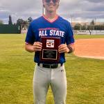 Courtesy photos
Montesanos Toren Crites holds his 1A Washington State Player of the Year plaque at Parker Field in Yakima.
