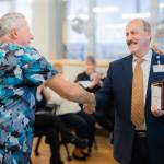 Harbor Regional Health CEO Tom Jensen presents the 2025 Employee of the Year Award to BIll Karlik. (Harbor Regional Health)