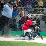 ELENA MILLS PHOTOGRAPHY An Aberdeen players (bottom) slides in safely during a win over Twin Harbor in a Little League District 3 Tournament game on Wednesday in Aberdeen.