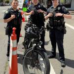 Aberdeen officers Jacob Shaw (from left), Dakota Reninger,and Tommy Wallace watch the corner of Wishkah and Broadway during Aberdeens festival Saturday.
